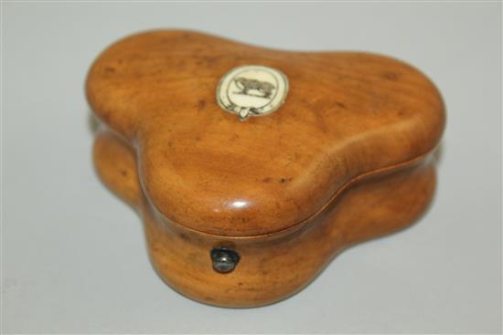 A 19th century fruitwood triform shaped gaming token box, 3.25in.